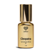 Gold bottle of 'Cleopatra' lash extension adhesive with 'Lovely' branding on a white background